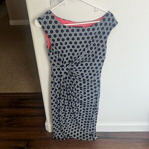 Figure flattering geometric dress with cinched side detail.